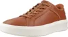A single brown Skechers sneaker with a white sole is shown against a white background. Náhled obrázku produktu