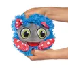 Hands holding a plush toy monster. Produktbild-Vorschau