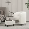 A white armchair and ottoman are placed next to a bed in a bedroom setting. Produktbild-Vorschau