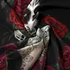 A close-up view of a black fabric with a detailed print of red roses and a sugar skull design. Produktbild-Vorschau