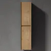 A tall, narrow wooden cabinet mounted on a gray wall, casting a shadow. Produktbild-Vorschau