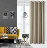 A living room scene with a yellow sofa, decorative pillows, a coffee table, and a large beige curtain covering a window. Produktbild-Vorschau