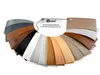 A fan of different colored and textured samples of a product, attached to a keychain with a brand logo and website. Produktbild-Vorschau