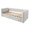 A beige upholstered daybed with a slatted mattress base and two storage drawers underneath, shown from a diagonal front-side angle against a white background. Náhľad obrázku produktu
