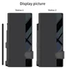 Two identical black phone cases are displayed side-by-side, labeled 'Status 1' and 'Status 2'. A stylus is shown to the left of the first case. Anteprima dell’immagine prodotto