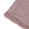 A close-up view of a fluffy pink blanket with visible stitching. Produktbild-Vorschau