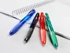 Four pens are arranged on a notebook. Produktbild-Vorschau