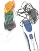A hair clipper kit with various attachments and a charging adapter, laid out on a white surface. Produktbild-Vorschau