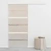A sliding door with a glass and aluminum design is shown in a room setting, with a laundry basket in the foreground. Náhľad obrázku produktu