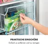 A hand is shown pulling out a clear plastic drawer from a freezer, containing boxes of frozen food. Produktbild-Vorschau