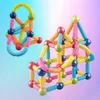 Two colorful magnetic building block structures against a gradient background. Náhled obrázku produktu