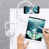 A person is using a tablet to draw, with a phone mounted on a flexible arm holder above it. Podgląd zdjęcia produktu
