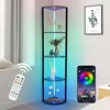 A corner display shelf with LED lighting, a remote control, and a smartphone app interface. Produktbild-Vorschau