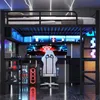 A gaming loft bed setup with a desk, chair, and computer equipment, illuminated by LED lights. Anteprima dell’immagine prodotto