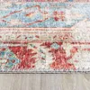 A close-up view of a rug with a patchwork design, showing the texture and intricate patterns. Produktbild-Vorschau