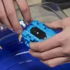 Hands holding a blue Beyblade launcher over a blue arena. Anteprima dell’immagine prodotto