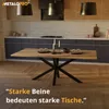A dining table with black metal legs in a modern kitchen setting. Voir les images du produit