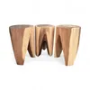 Three wooden stools are arranged in a line against a white background. Anteprima dell’immagine prodotto