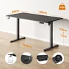 A black height-adjustable desk with dimensions shown. Anteprima dell’immagine prodotto