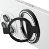 A close-up shot of a black ring stand with rhinestones attached to the back of a white smartphone. Podgląd zdjęcia produktu