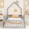 A child's house-shaped bed with bedding and decorative stars on the wall. Anteprima dell’immagine prodotto