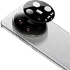 A close-up shot of a smartphone's rear camera module, with a protective glass cover hovering above it. Produktbild-Vorschau