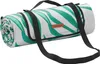 A rolled-up picnic blanket with a tropical leaf pattern and a carrying strap. Produktbild-Vorschau