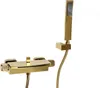 A gold-colored bathroom faucet and showerhead set against a white background. Podgląd zdjęcia produktu