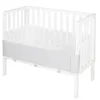 A white wooden crib with a gray fabric bumper pad attached to the inside of the crib rails. Produktbild-Vorschau