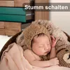 A newborn baby sleeping in a basket with a teddy bear. Anteprima dell’immagine prodotto
