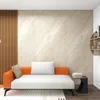A modern living room with a sofa, wall paneling, and a shelf. Anteprima dell’immagine prodotto
