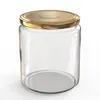 A clear, studio shot of an empty glass jar with a gold screw-on lid, presented on a white background. Voir les images du produit