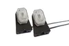 Two white lights with black bases and wires are shown against a white background. Produktbild-Vorschau