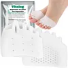 A product shot of toe separators with a close-up of feet wearing them, and packaging in the background. Podgląd zdjęcia produktu