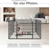 A puppy is inside a metal playpen in a modern living room setting. Náhled obrázku produktu