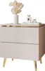 A beige nightstand with gold accents and legs, decorated with a vase of dried flowers and two perfume bottles. Produktbild-Vorschau