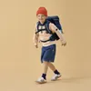 A young boy wearing a backpack and an orange beanie walks against a plain background. Voir les images du produit