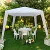 A white gazebo set up in a garden with a table and chairs, decorated for an event. Produktbild-Vorschau