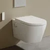 A wall-mounted toilet with a bidet function and a remote control on the wall. Podgląd zdjęcia produktu