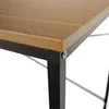A close-up view of the corner of a desk, showing the wooden tabletop and black metal legs. Náhľad obrázku produktu
