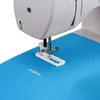A close-up view of a sewing machine's presser foot and needle positioned over a piece of blue fabric, with a small piece of fabric marked for a buttonhole. Produktbild-Vorschau