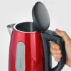 A hand is holding the handle of a red electric kettle with the lid open. Anteprima dell’immagine prodotto