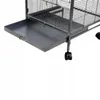 Close-up view of the bottom part of a metal bird cage, showing a pull-out tray and wheels. Náhled obrázku produktu