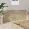 A close-up view of a wooden headboard in a bedroom setting. Náhľad obrázku produktu