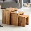A set of three wooden nesting tables in a living room setting. Produktbild-Vorschau