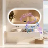 A modern bathroom with a large oval mirror, sink, and basket of towels, with musical notes overlaid on the mirror. Podgląd zdjęcia produktu
