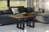 A modern living room with a grey sectional sofa and a wooden coffee table in front of it. Podgląd zdjęcia produktu