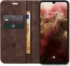 A brown leather flip case for a smartphone, with cards and banknotes inserted. Produktbild-Vorschau