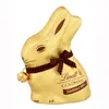 A golden chocolate Easter bunny with a brown ribbon and bell. Produktbild-Vorschau