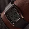 A close-up shot of a person's wrist wearing a digital watch. Náhled obrázku produktu